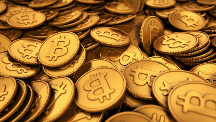 3D rendered close up illustration of a large group of golden Bitcoins with depth of field blur