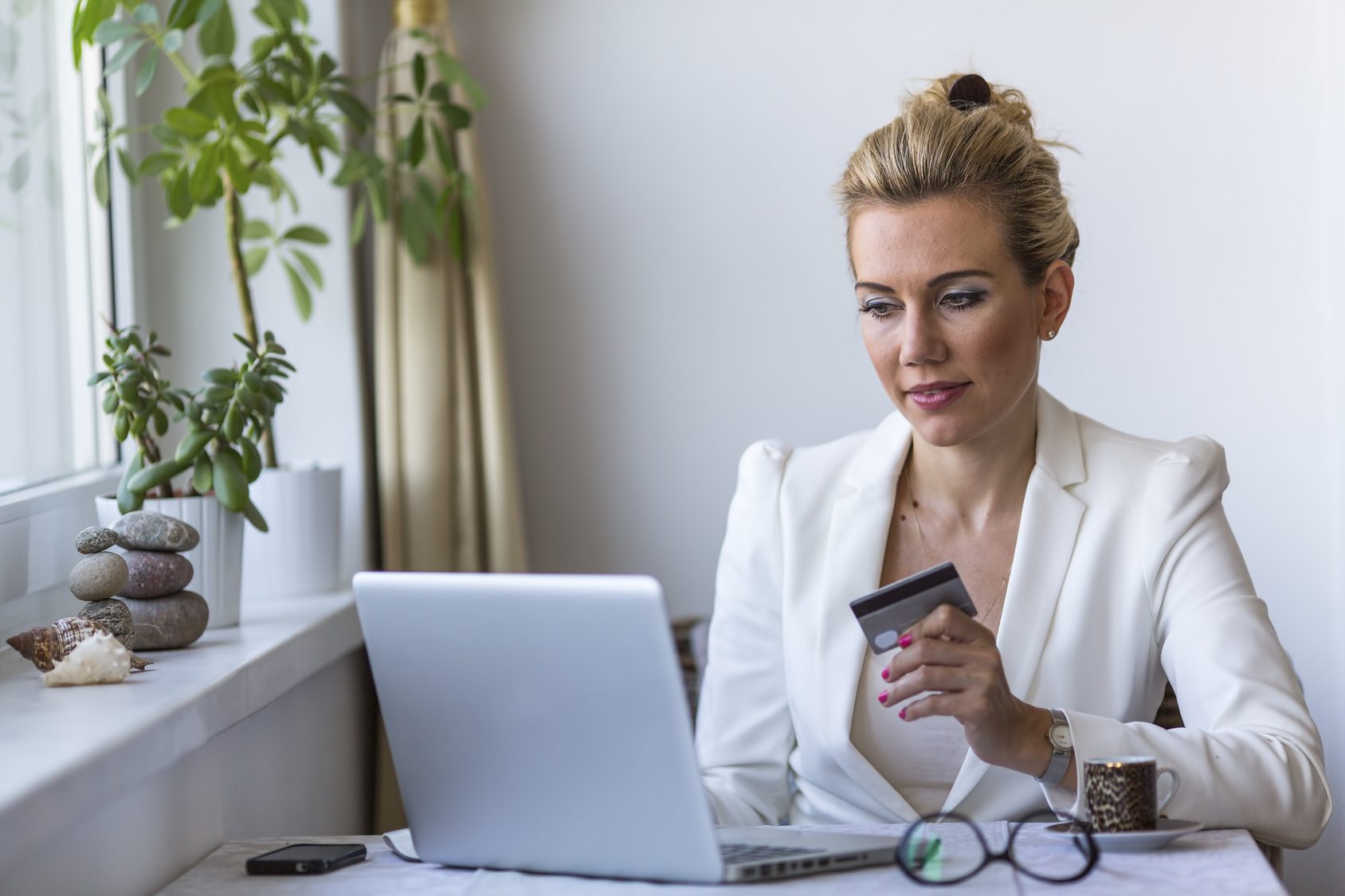 Internet shopping. Woman shopping online with credit card and laptop.